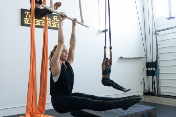 3 students trying different apparatus' during Intro to Aerial Arts