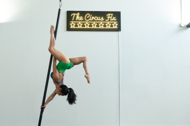 A woman inverted on aerial pole