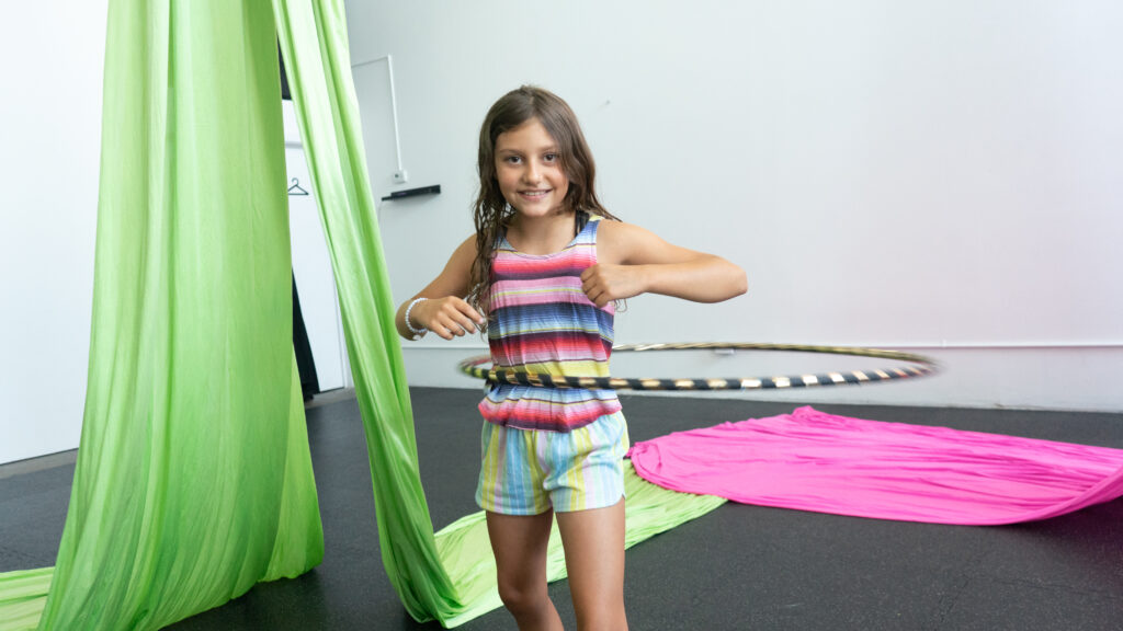 Young person in a hula hoop - birthday party ideas