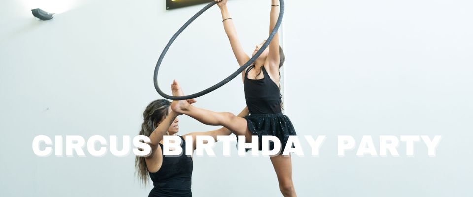 Picture of a young girl being instructed on a hoop to indicate fun birthday party ideas. 