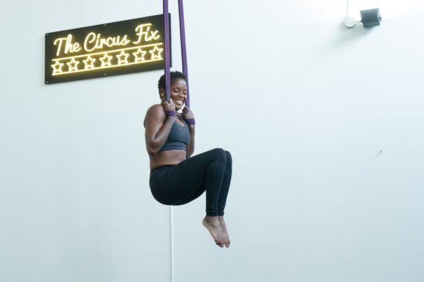 A woman in the air on straps