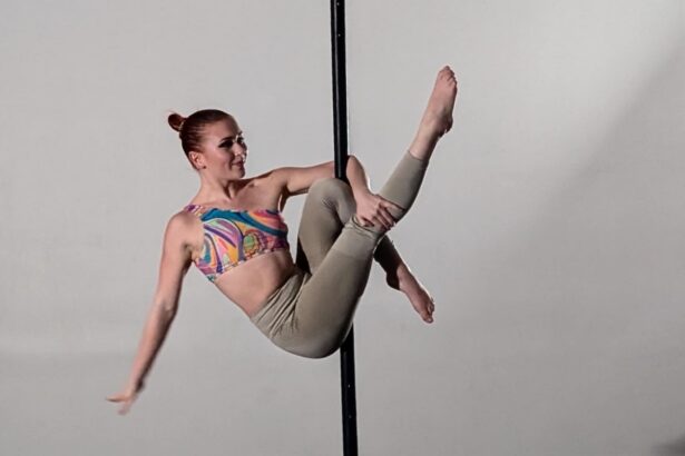 Aerialist hanging on a pole