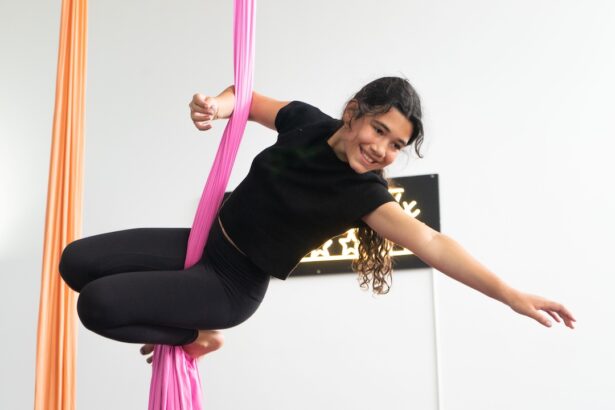 A young person in the silks during a teen seasonal circus session