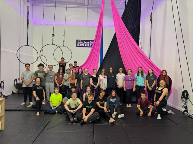 A large group of students at a school group party.