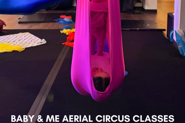 Baby standing on mom who is hanging in a hammock